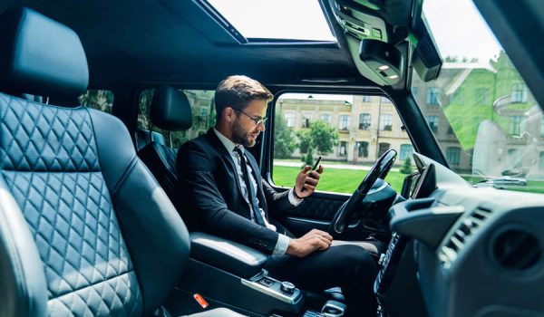 handsome-young-businessman-looking-on-his-smart